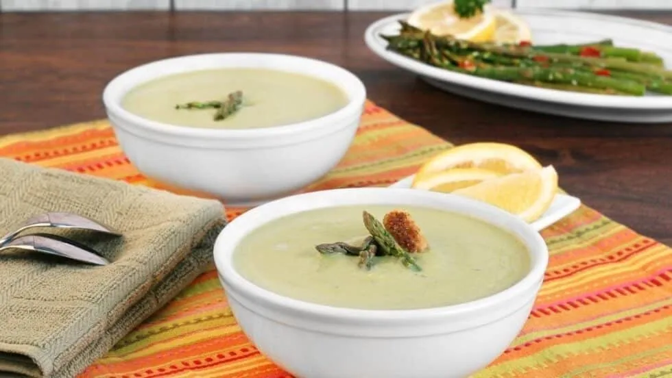 Cream of asparagus soup garnished with parsley